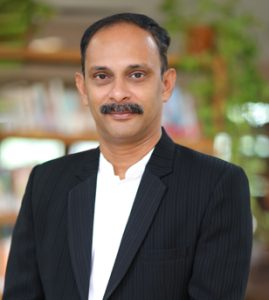 Dr. Elson John